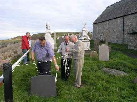 A new rope being fitted to the flagpole